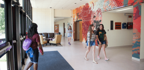 Students inside Whipple Hall walking to class